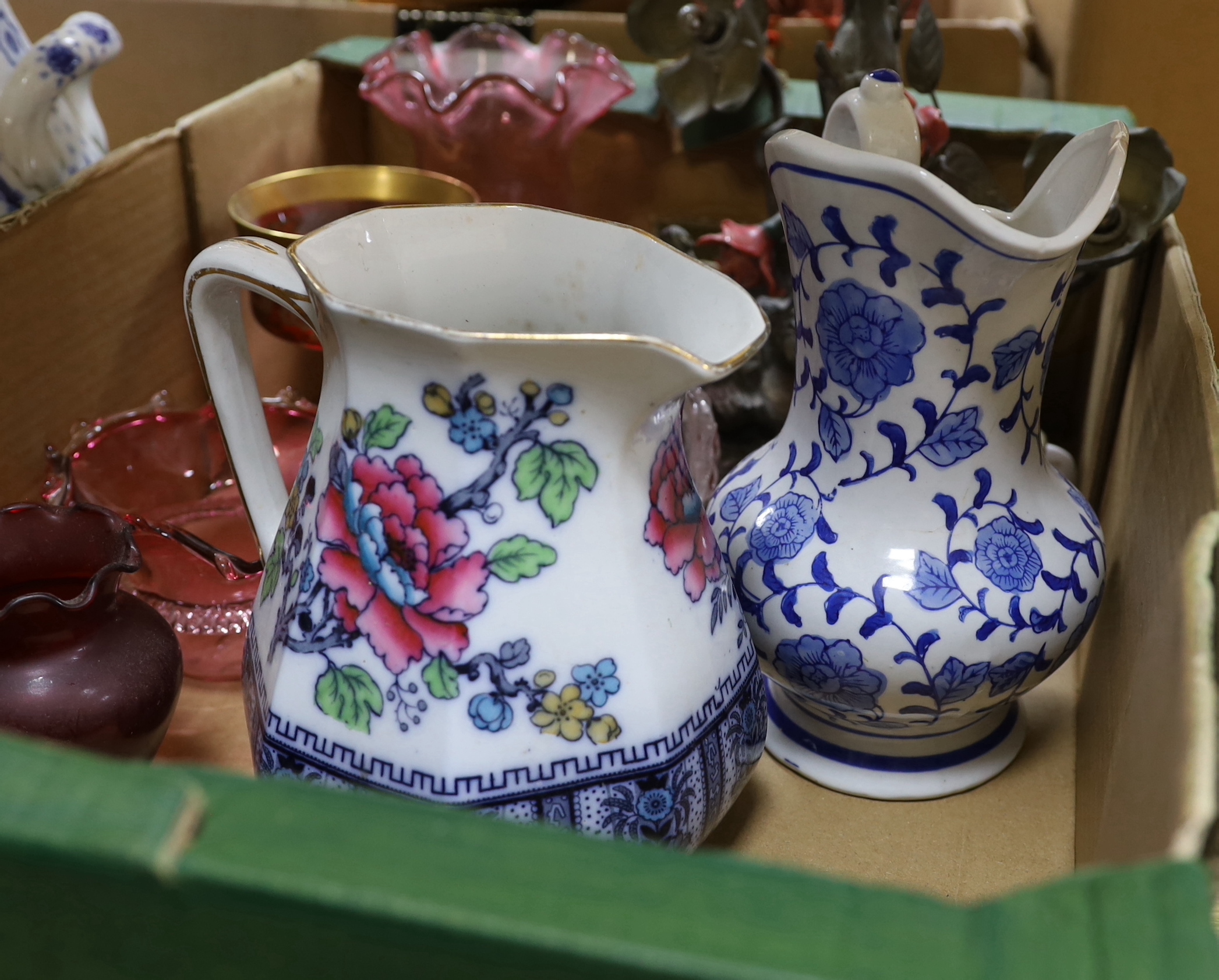 A large Arts and Crafts style two handled blue and white pot, a vase, two jugs, a quantity coloured glass and a table lamp